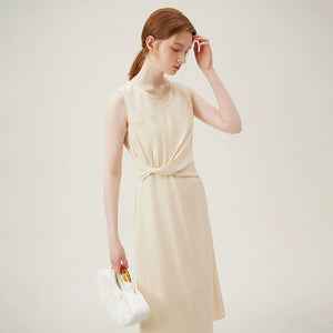 Detail of soft twist fabric design on beige cotton dress