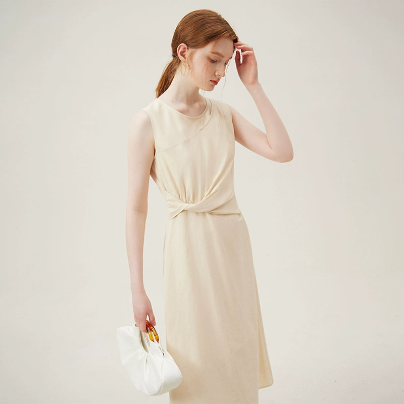 Detail of soft twist fabric design on beige cotton dress