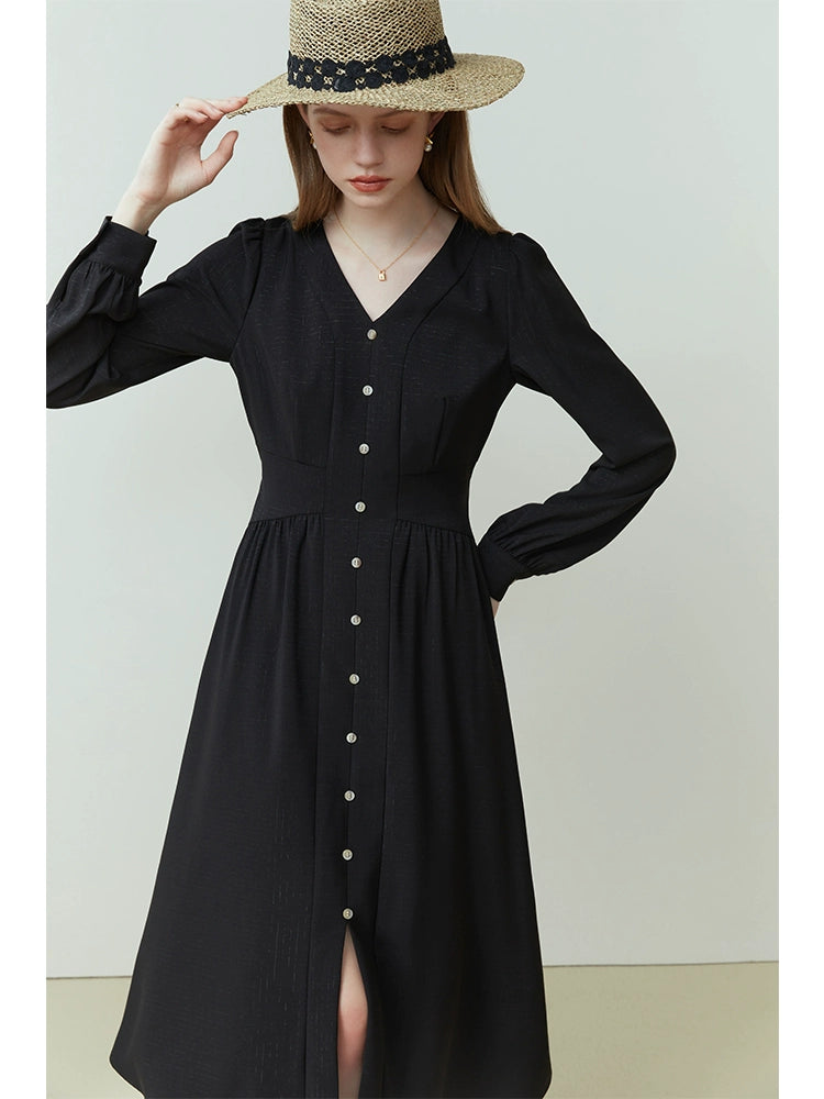 Model wearing beige linen midi dress with tied waist and cap sleeves