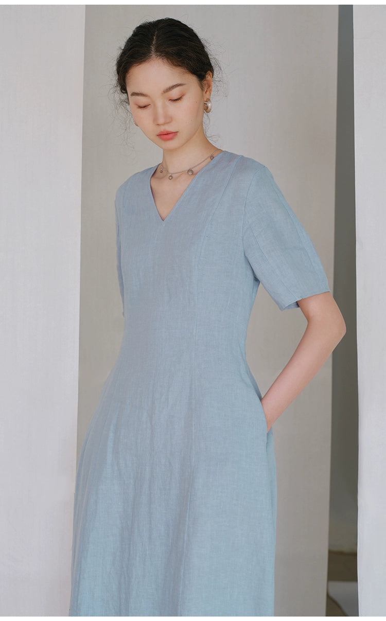 Linen V-neck midi dress with short sleeves on wooden hanger