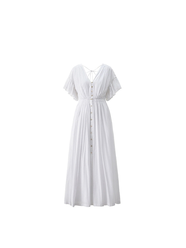  Side seam and soft fabric detail of white cotton dress