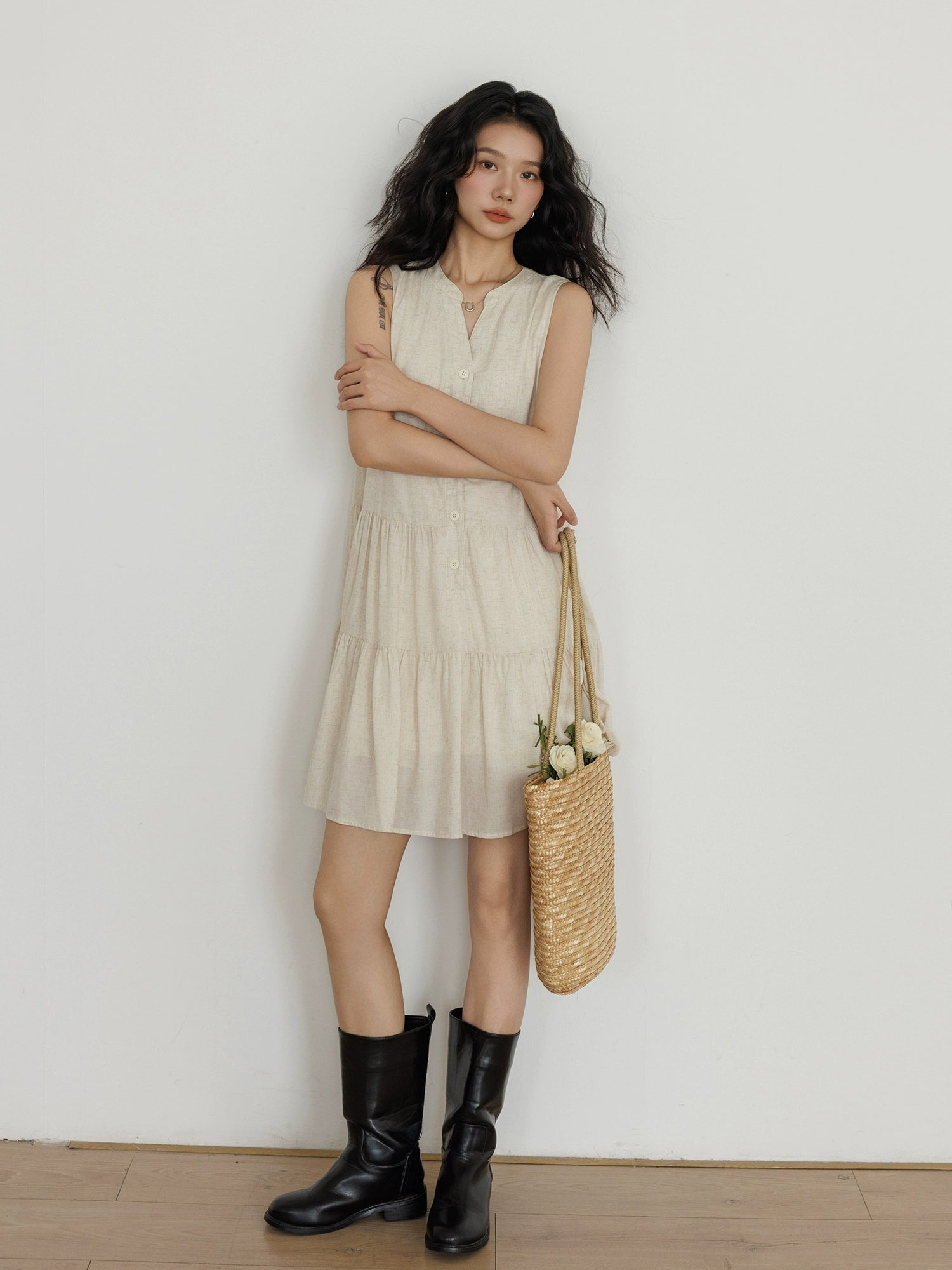  Sleeveless beige linen vest dress styled with black boots