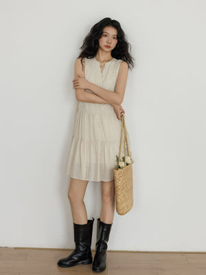  Sleeveless beige linen vest dress styled with black boots