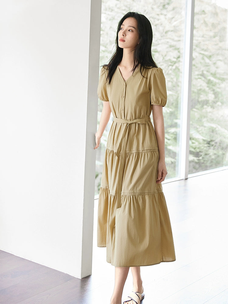 Romantic tiered A-line dress with cinched waist and puff sleeves