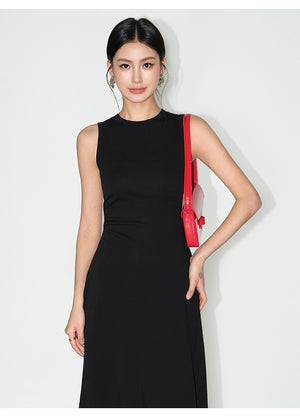 Minimalist black dress with sculpting waistline