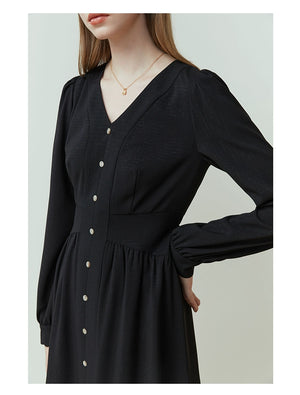 Close-up of linen fabric and hidden zip fastening on neutral-toned dress