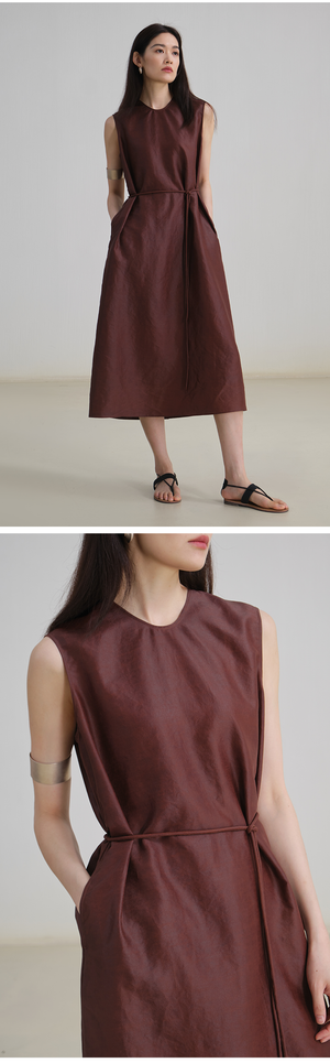  Close-up of soft U-neckline on minimalist linen dress