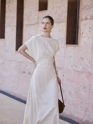 Beige maxi dress with flutter sleeves and sculpted waist