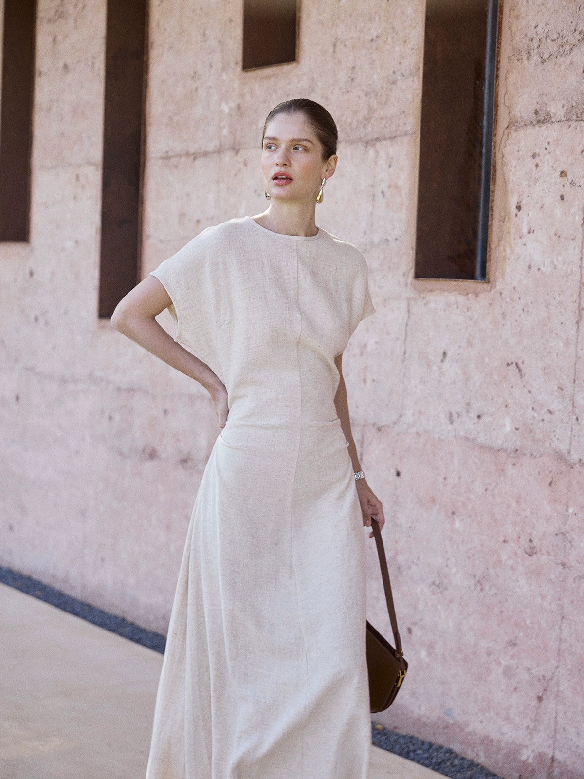 Beige maxi dress with flutter sleeves and sculpted waist
