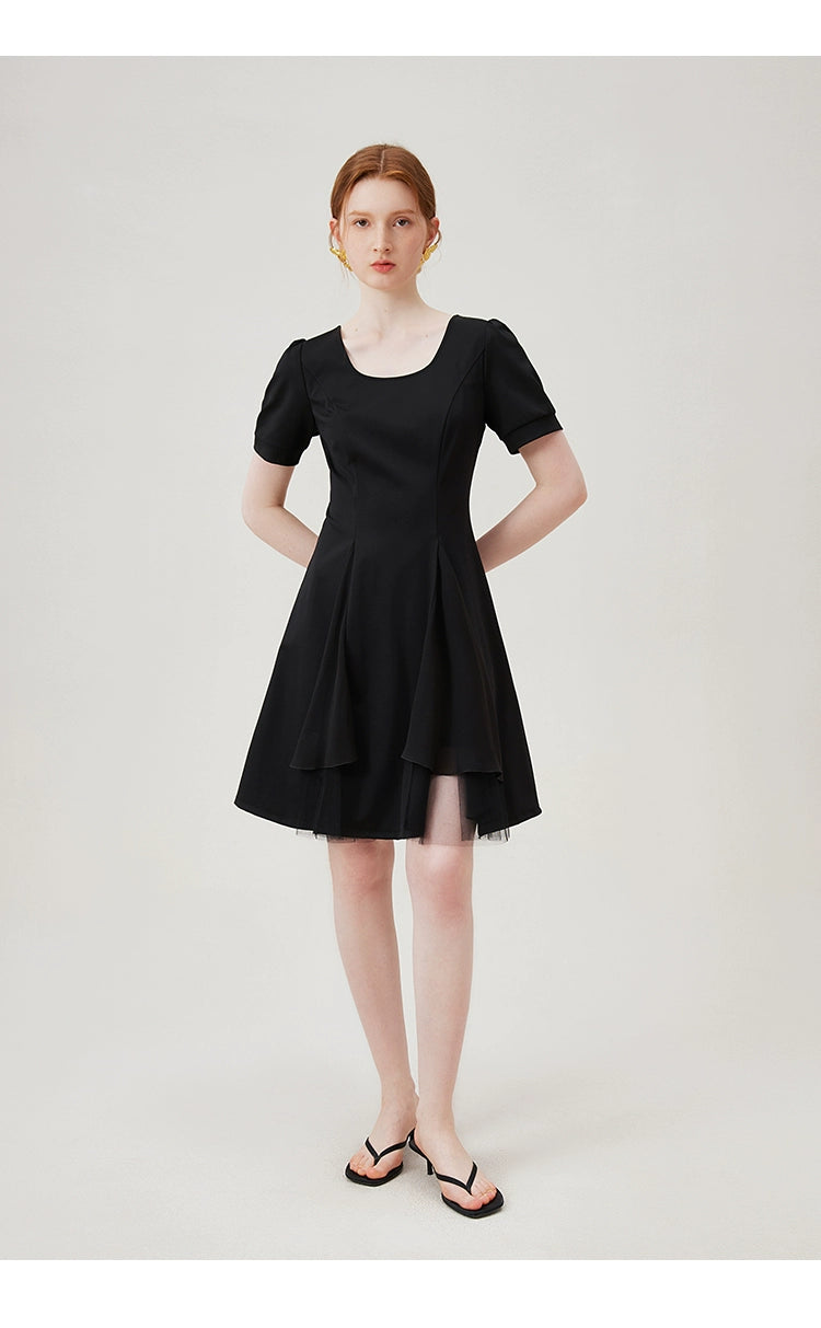 Scoop neckline and structured seams of dress