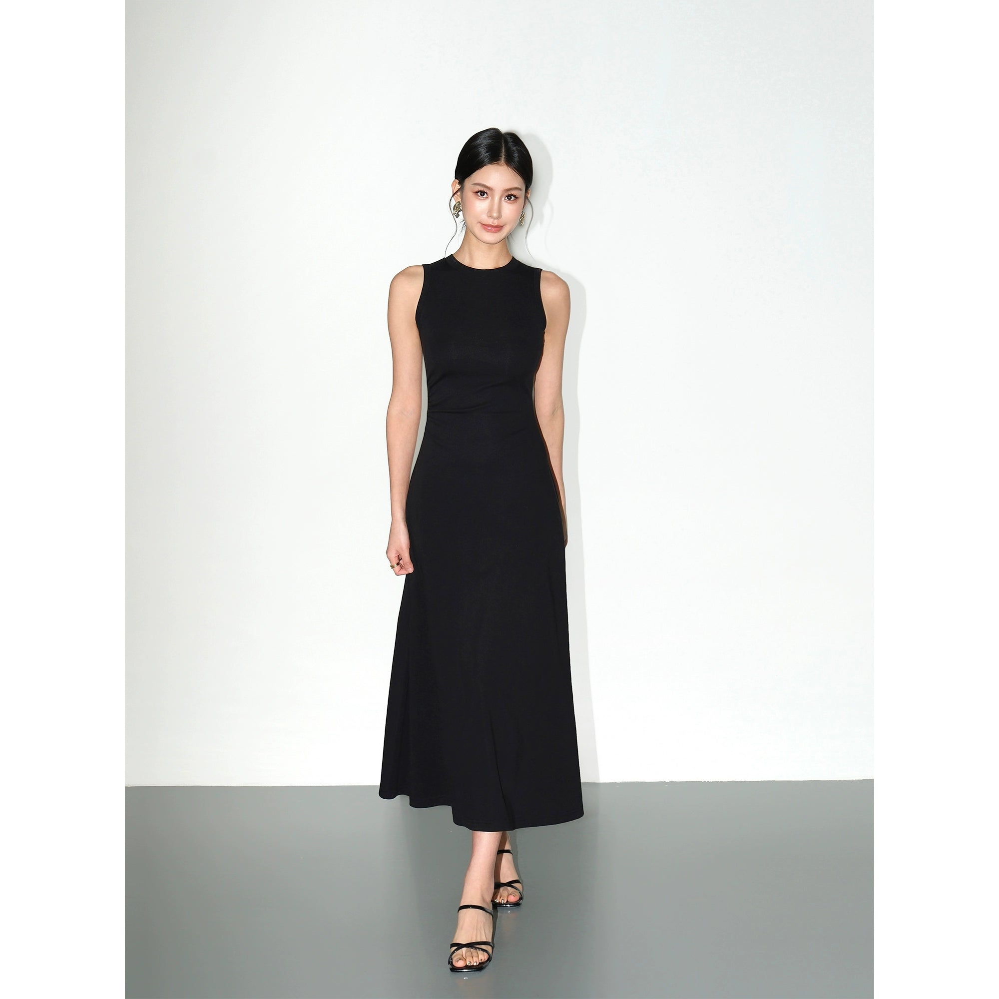 Slim-fit black knit tank dress with cinched waist