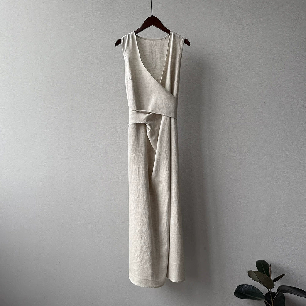 Slimming linen maxi dress styled with woven bag
