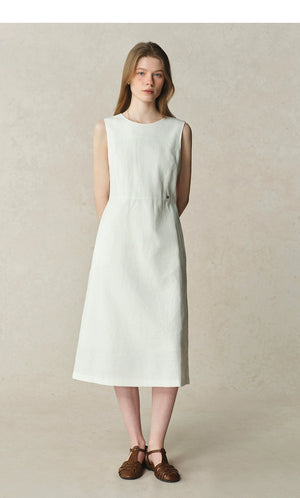 Minimalist white dress styled for warm days