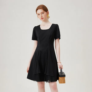  Full front view of black dress with tulle inserts