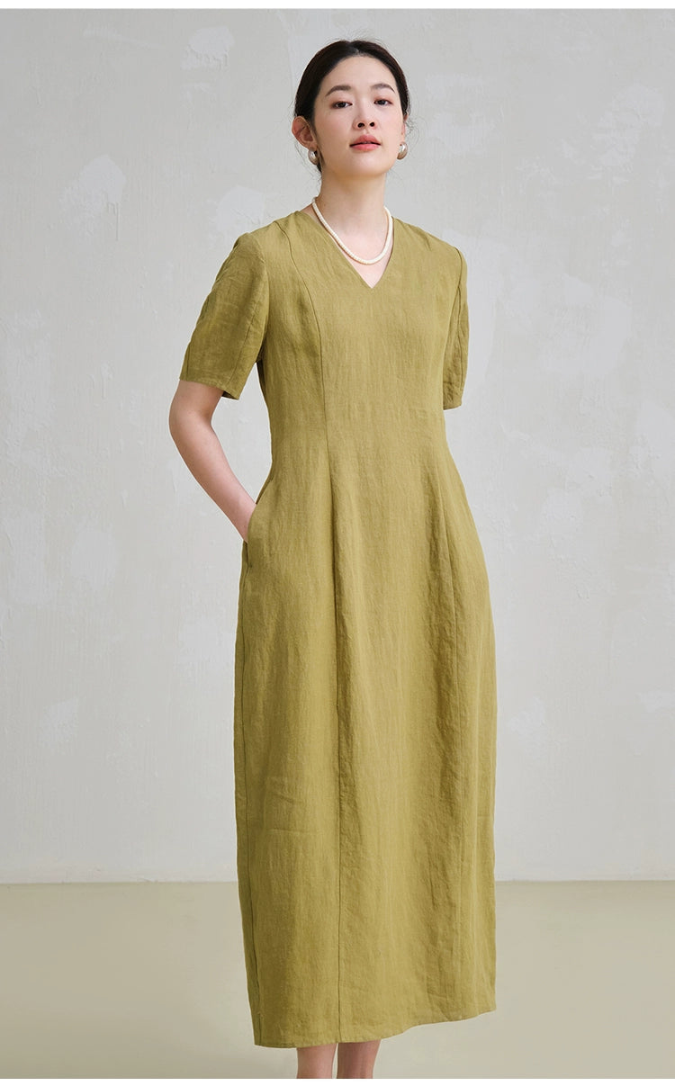 Model in linen midi dress with tailored fit and short sleeves