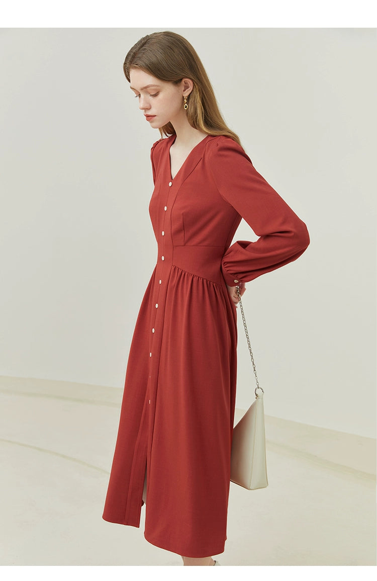 Model wearing beige linen midi dress with tied waist and cap sleeves