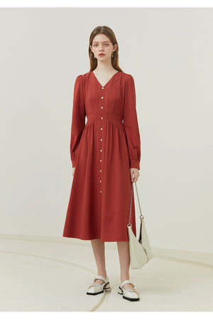 Side view of ivory linen dress highlighting fitted waist and short sleeves