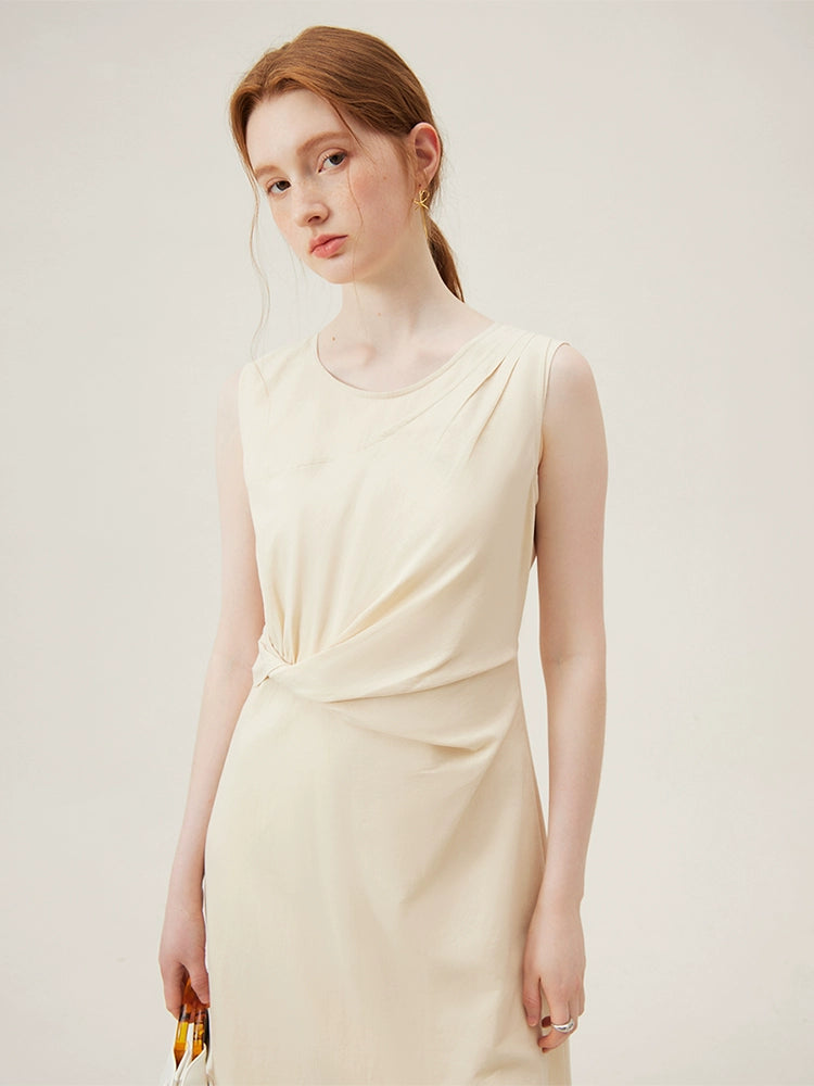Back view of beige sleeveless midi dress with center slit