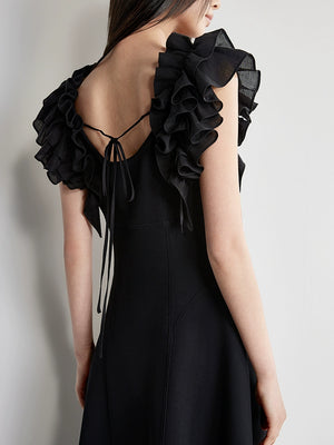 Back tie detail of black cotton A-line dress