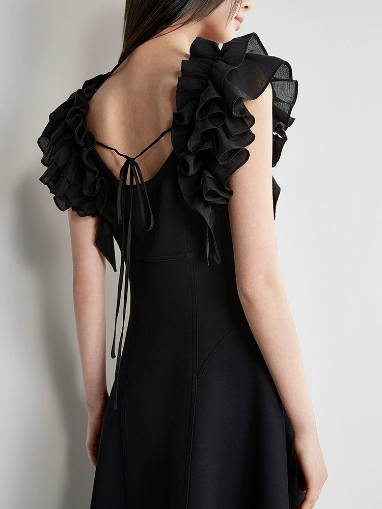 Back tie detail of black cotton A-line dress