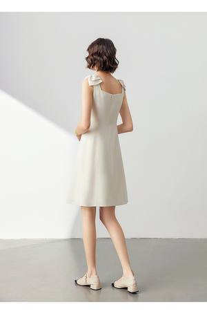 Model wearing the dress styled with-blazer and heels