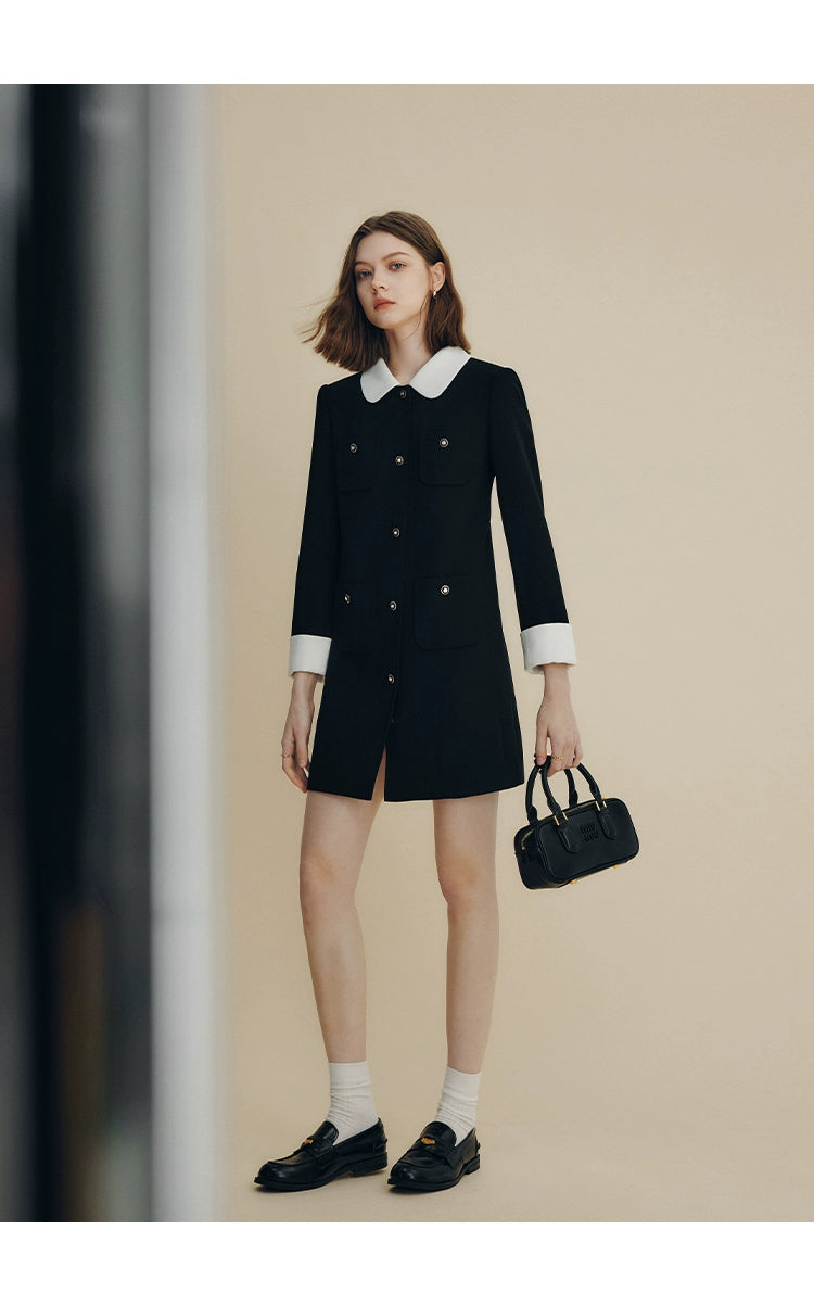 Black structured dress coat with gold button accents