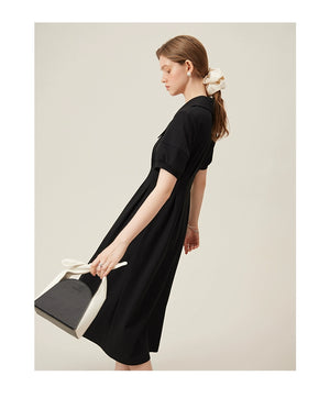 Detail shot of collar and upper bodice on black buttoned linen dress