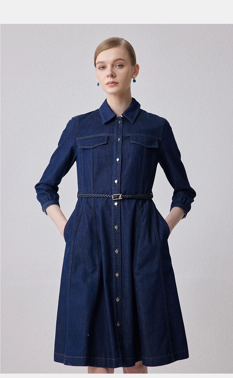 Front view of dark denim belted shirt dress with pockets