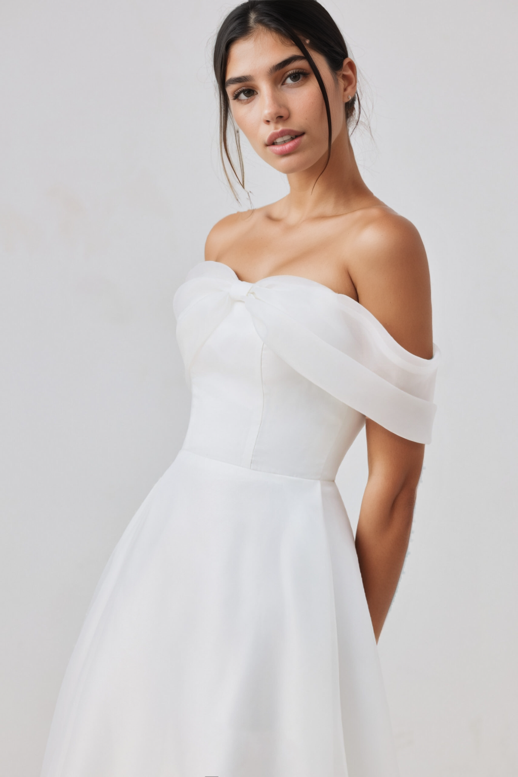 White chiffon strapless dress with a bow at the bust